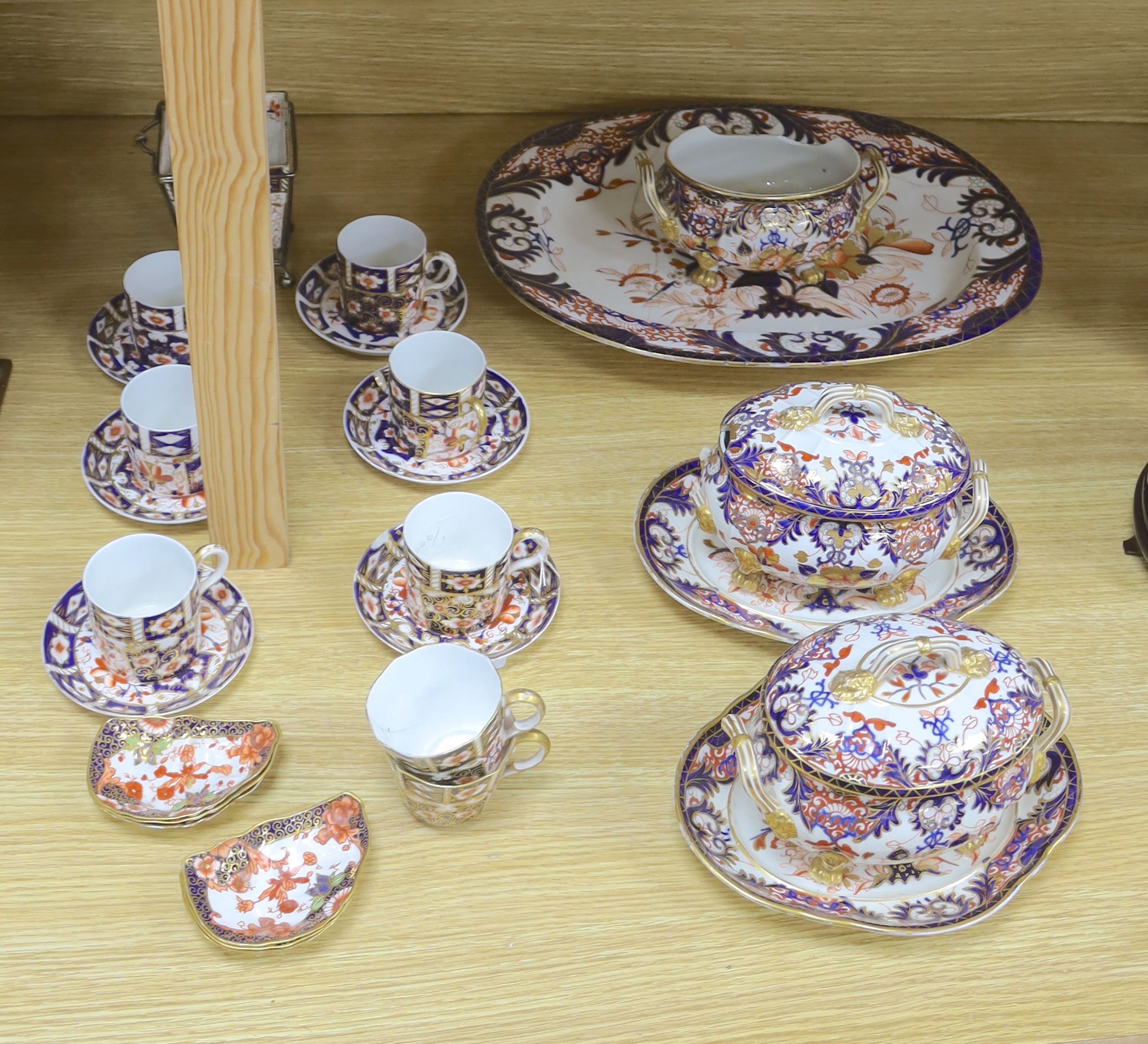 A collection of Royal Crown Derby Imari patterned ceramics including cups, side plates and platter